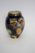 Carlton ware design decorated with a phoenix on a blue ground, 15cm high