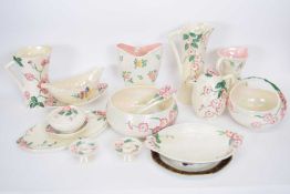 Group of Maling lustre wares decorated with peony including small candlesticks, salad set with