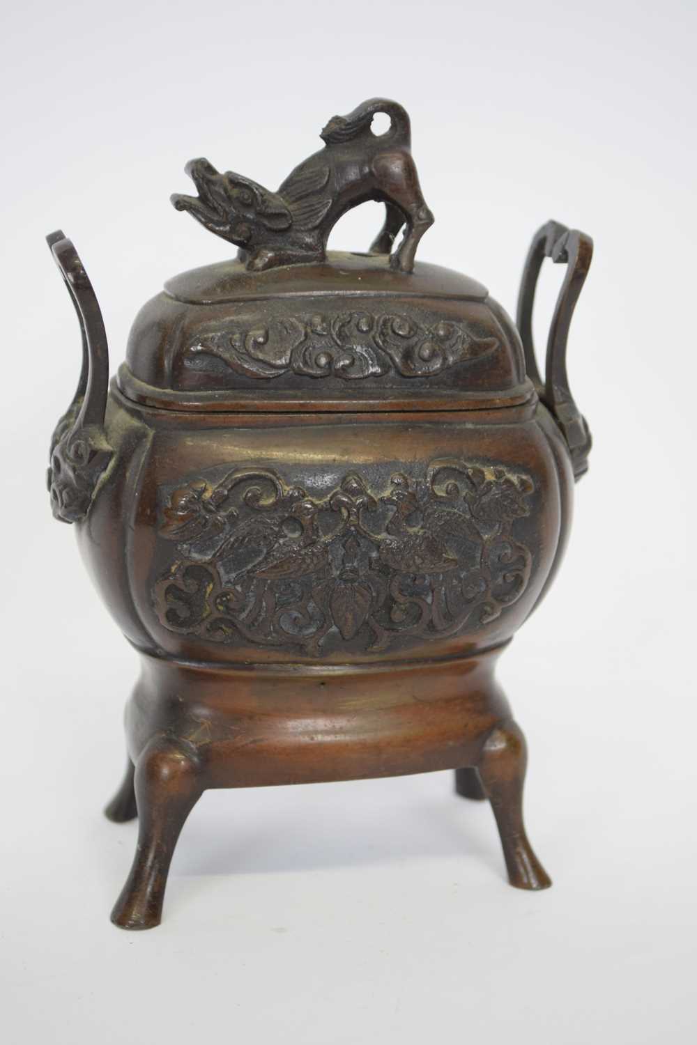 Oriental incense burner and cover raised on four feet, the vase with an impressed design of birds in - Image 4 of 6