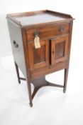 19th century mahogany pot cupboard with galleried top over a body with dummy drawer front, two