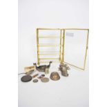 Miniature glazed table top display cabinet containing various small novelty items to include a white
