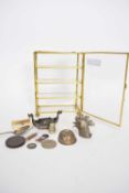 Miniature glazed table top display cabinet containing various small novelty items to include a white