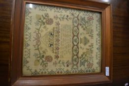 19th century needlework sampler decorated with foliage, animals and religious text, signed Elizabeth