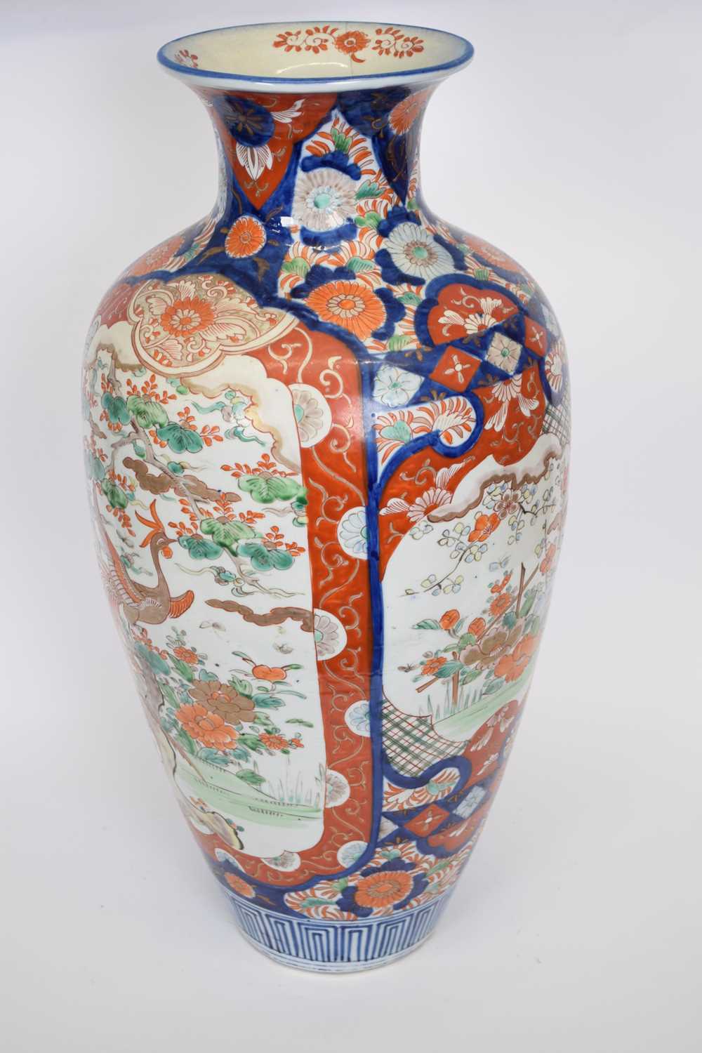 Large Japanese porcelain vase of baluster shape decorated with panels of flowers and birds within