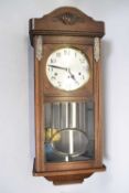 Early 20th century oak cased wall clock with silvered dial and three train movement, 80cm high