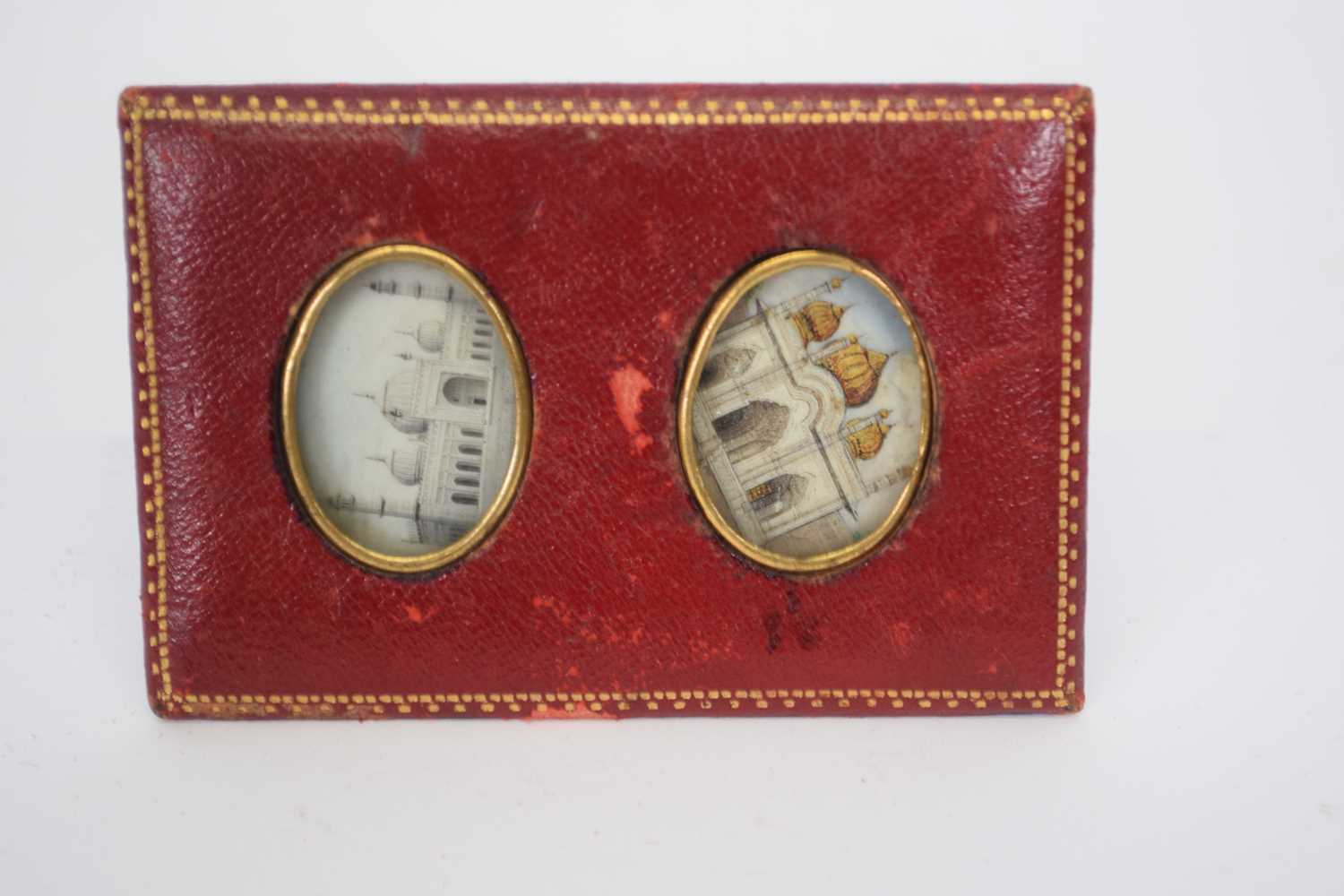 Small leather frame containing two Indian painted miniatures on ivory of Taj Mahal