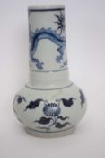 Chinese porcelain vase, thickly potted and decorated in blue and white with a dragon, 22cm high