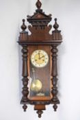 Late 19th century Vienna wall clock in architectural case with glazed door, plain dial with Roman