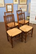 Set of four 20th century spindle back and rush seated dining chairs