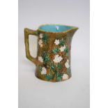 Victorian Majolica jug decorated with blossom, 15cm high