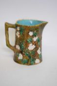 Victorian Majolica jug decorated with blossom, 15cm high