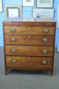 Late Georgian mahogany chest with four graduated drawers fitted with oval brass handles, raised on