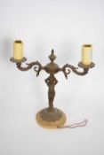 20th century bronzed metal two-light table lamp with putto supports, 37cm high