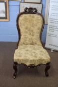 Victorian mahogany framed nursing chair with front cabriole legs and floral upholstery, 107cm high