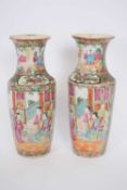 Pair of Cantonese porcelain vases with typical polychrome designs of figures with panels of