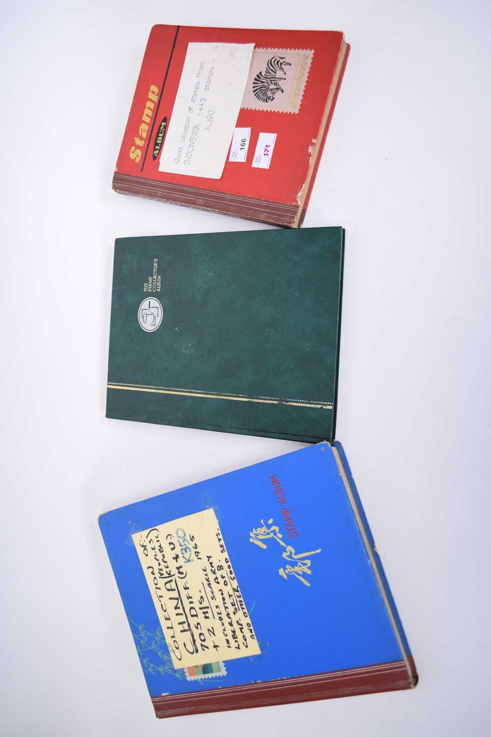 Three stamp albums, one containing collection of stamps from Indonesia, over 400 in total, and a