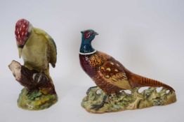 Beswick model of a woodpecker and a further Beswick model of a pheasant (2), the woodpecker 21cm
