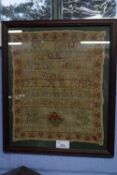 19th century needlework sampler decorated with rows of numbers and letters, signed 'Liza Webb,