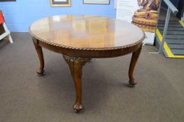 Edwardian walnut oval extending dining table set on cabriole legs together with two accompanying