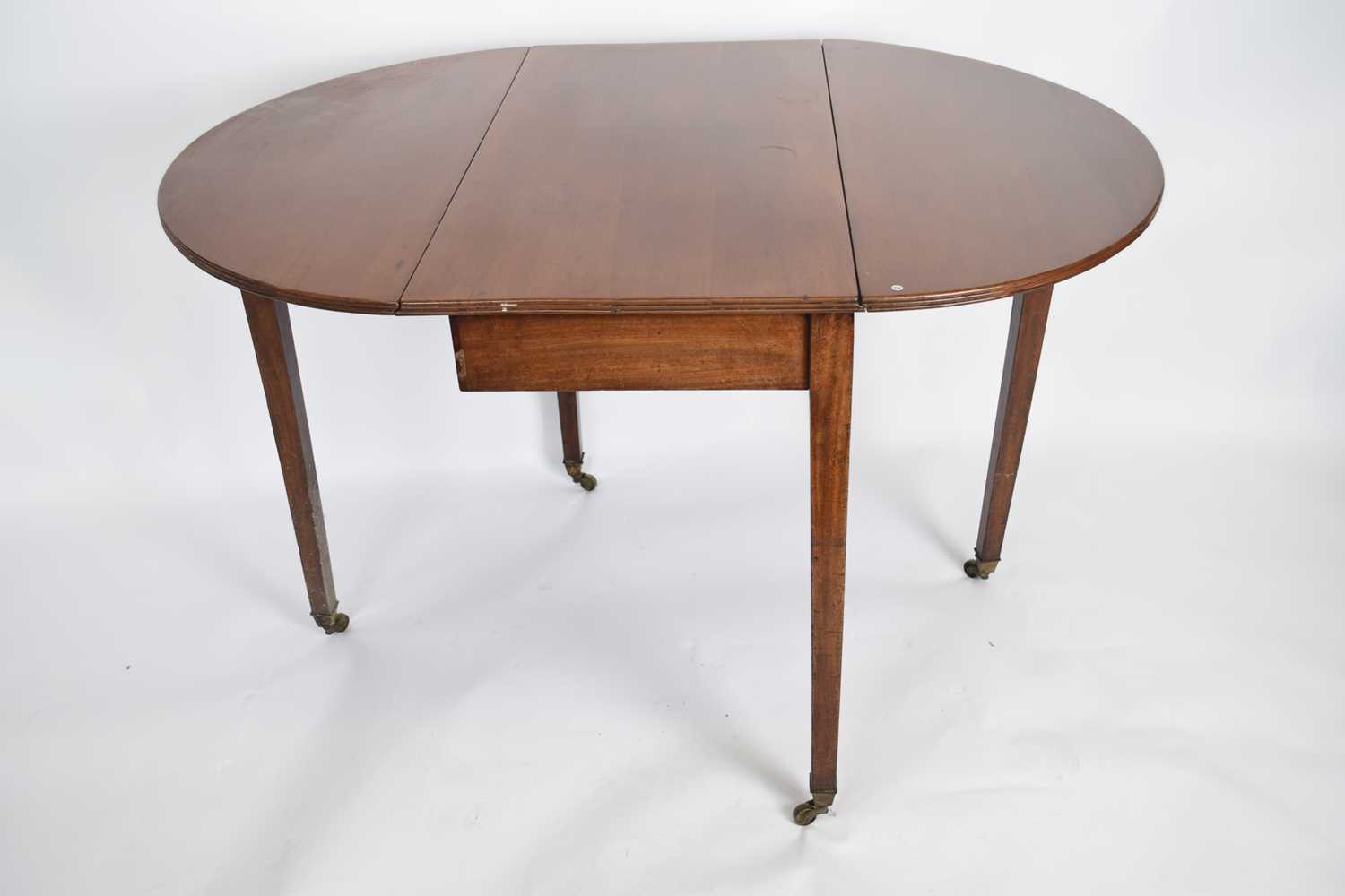 Late 19th century mahogany oval drop leaf table raised on tapering legs with brass end caps and - Image 2 of 2