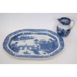 Large pearlware blue and white platter together with a pearlware jug, the platter 50cm long (2)
