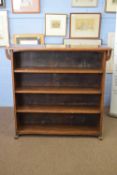 Early 20th century oak bookcase cabinet with four shelves raised on small plinth supports, 122cm