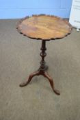 Small mahogany wine table with shaped top over a turned column and tripod base, 73cm high (a/f)