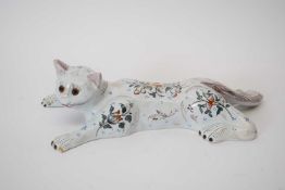 Galle style faience cat with glass eyes, the base with monogram 'MG' and No 1213, 24cm high