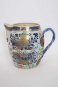 Large 18th century Chinese export porcelain cider jug with intertwined handle (a/f)