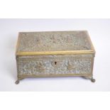 Unusual Indian pressed brass casket with hinged lid, decorated with various figures and foliage,