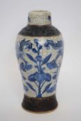 Crackle ware vase with a blue underglaze decoration of dragons, 21cm high