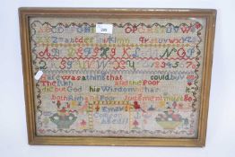 Victorian needlework sampler decorated with rows of letters and religious text, signed 'Emily