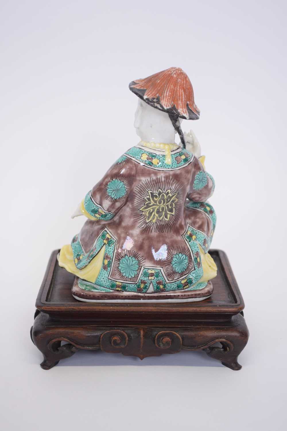 Chinese ceramic figure of a chinaman on wooden base with predominantly famille vert decoration on - Image 3 of 5