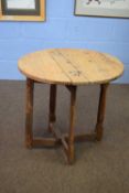 Small 19th century Swedish occasional table with circular top and single drop leaf raised on