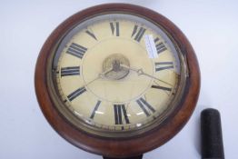 Late 19th century postman's alarm clock type clock with circular dial and a stained beech case,