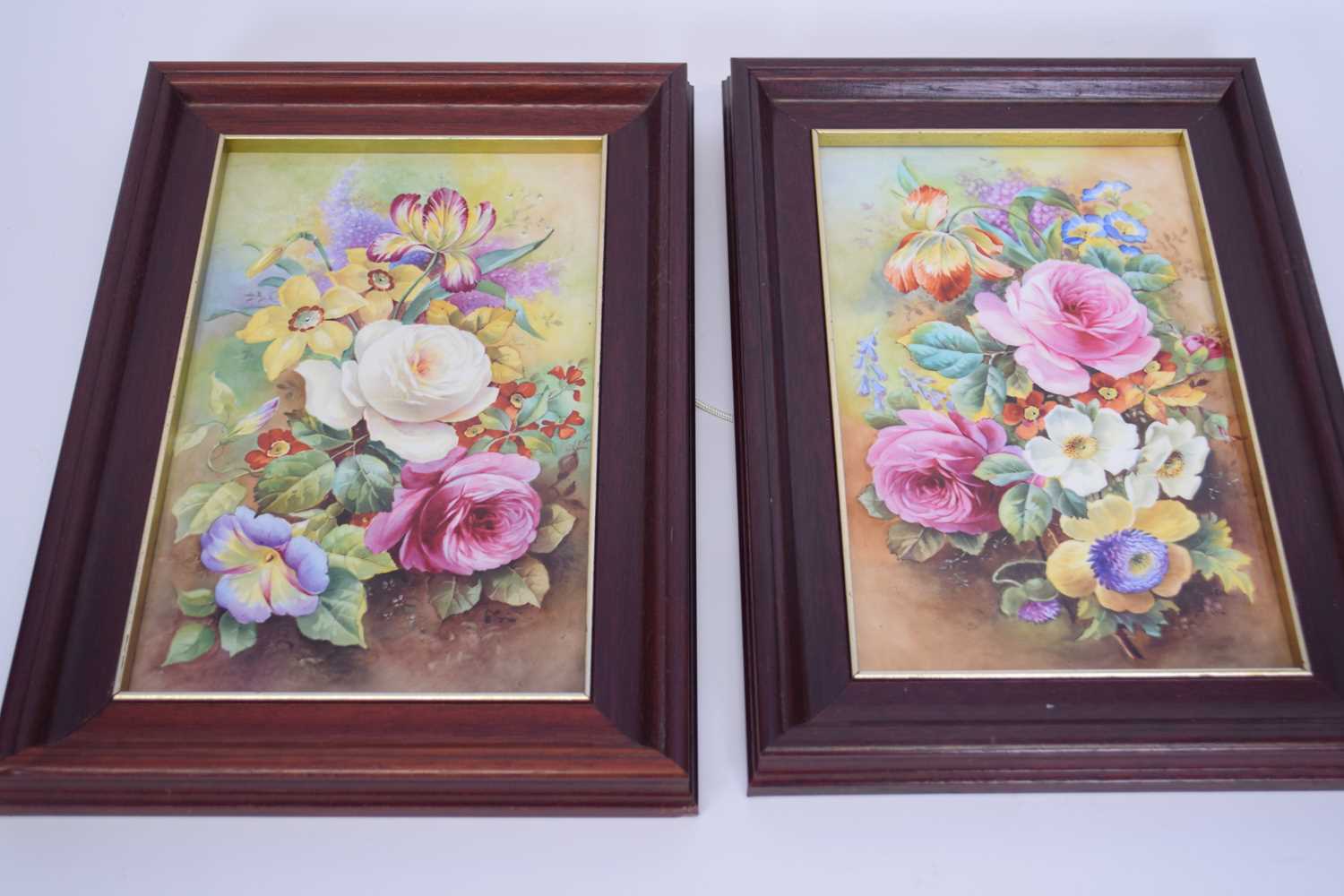 Pair of framed porcelain plaques painted with floral sprays, possibly by A Holland, Wedgwood and