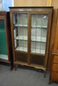 Edwardian mahogany and inlaid china display cabinet with two lead glazed doors and shelved interior,
