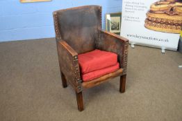 Early 20th century brown leather upholstered small armchair with sprung seat, 56cm wide