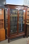 Late 19th/early 20th century mahogany framed shop display cabinet with two glazed doors opening to a