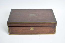 19th century rosewood and brass bound writing slope of hinged form with fitted interior, 40cm wide