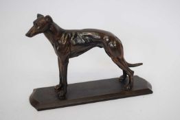 Bronzed metal model of a greyhound, on rectangular base, 22cm long