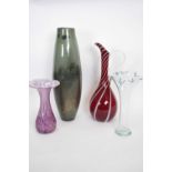 Group of four Art glass wares including a ewer with streaked white decoration on ruby ground, tall