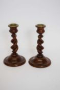 Pair of olive wood candlesticks with barley twist stems and brass mounts to top (2), 17cm high