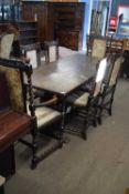 Early 20th century oak refectory style dining table set on heavy pineapple legs and 'H' stretcher