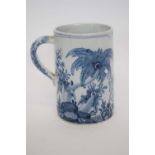 Delft tankard with armorial flanked by floral design and monogram to base, 14cm high