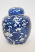 Chinese porcelain jar and cover with prunus decoration on a blue ground