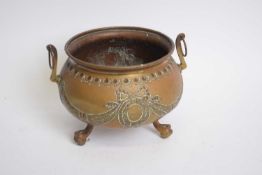 Small brass double handled jardiniere of circular form decorated with swag detail raised on three