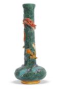An unusual Bretby vase, the green seaweed ground encircled by a scaly dragon in orange, 44cm high