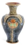 Group of Doulton wares comprising a vase with tube lined floral decoration, further Art Nouveau vase