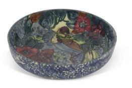Large bowl with tube lined Art Nouveau design of a bird amongst foliage, signed by R Dean, unmarked,